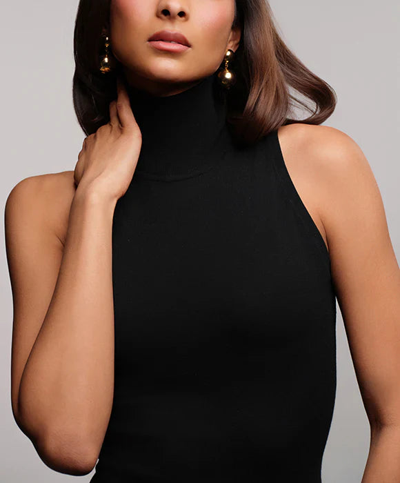 How to Wear a Black Sleeveless Turtleneck Year-Round